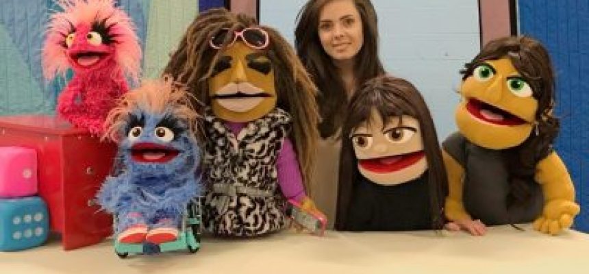 Bridges Festival presents a puppeteer from Steven Botelho's Our Space next to her five puppets during march break